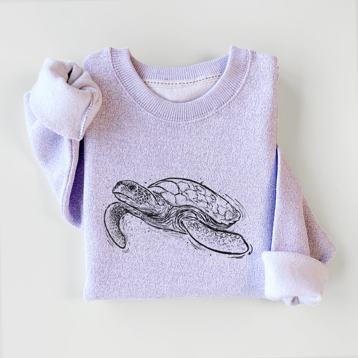 Ice purple knit sweatshirt printed with a black ink illustration of a hawksbill sea turtle swimming, with a patterned shell, styled flat.