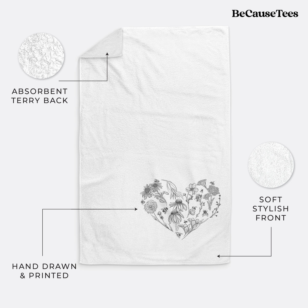 White hand towel printed with a heart shape filled with black ink flowers and bees.