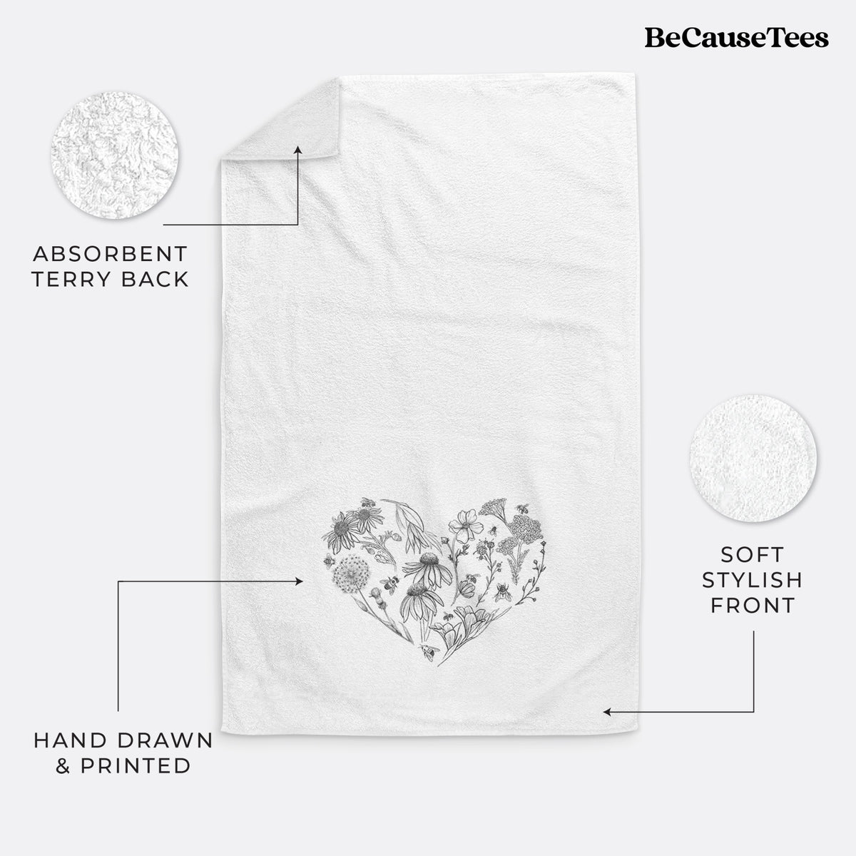 White hand towel printed with a heart shape filled with black ink flowers and bees.