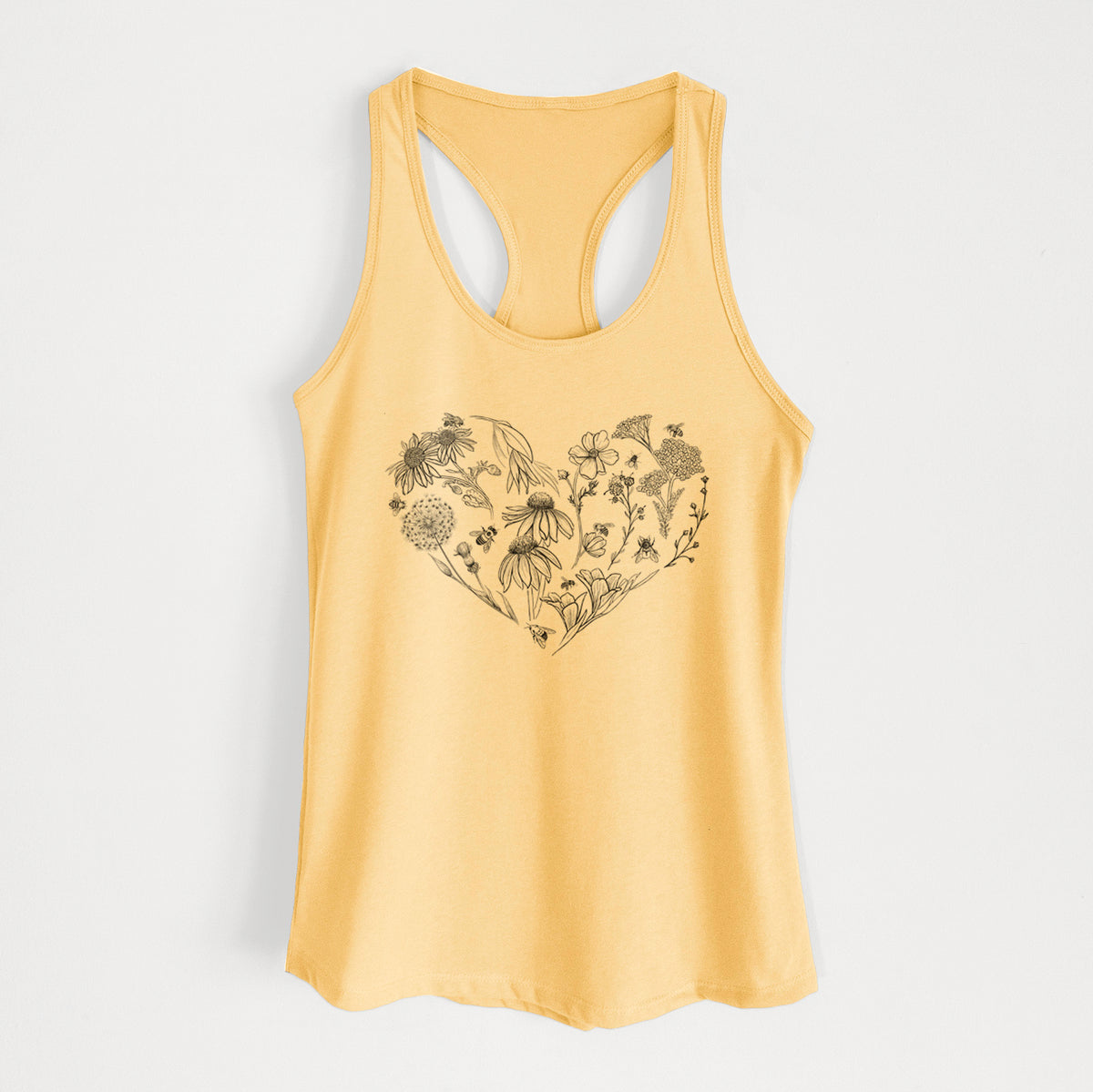 Banana cream women's racerback tank top laid flat, printed with a heart shape filled with black ink flowers and bees.