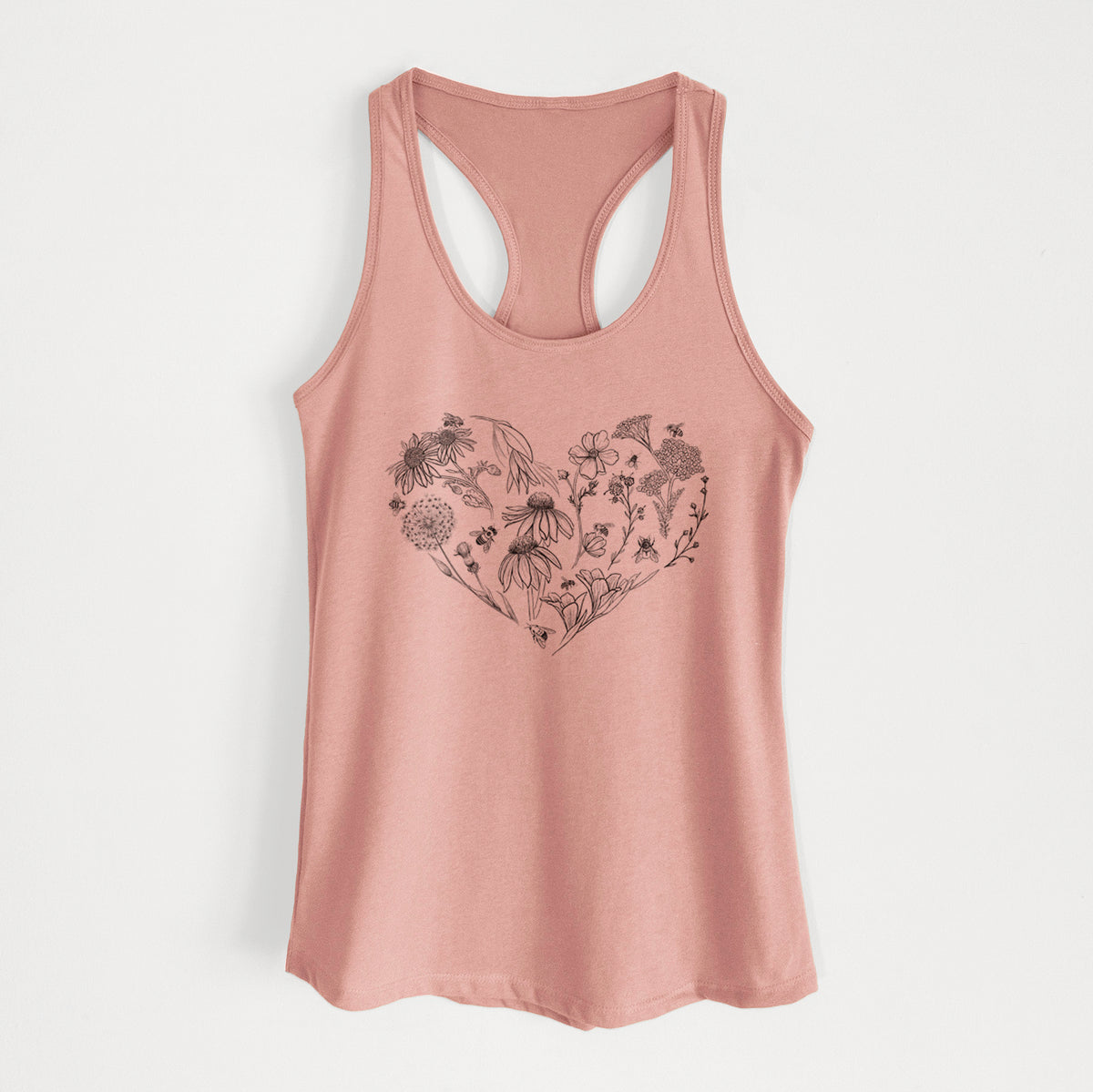 Desert pink women's racerback tank top laid flat, printed with a heart shape filled with black ink flowers and bees.