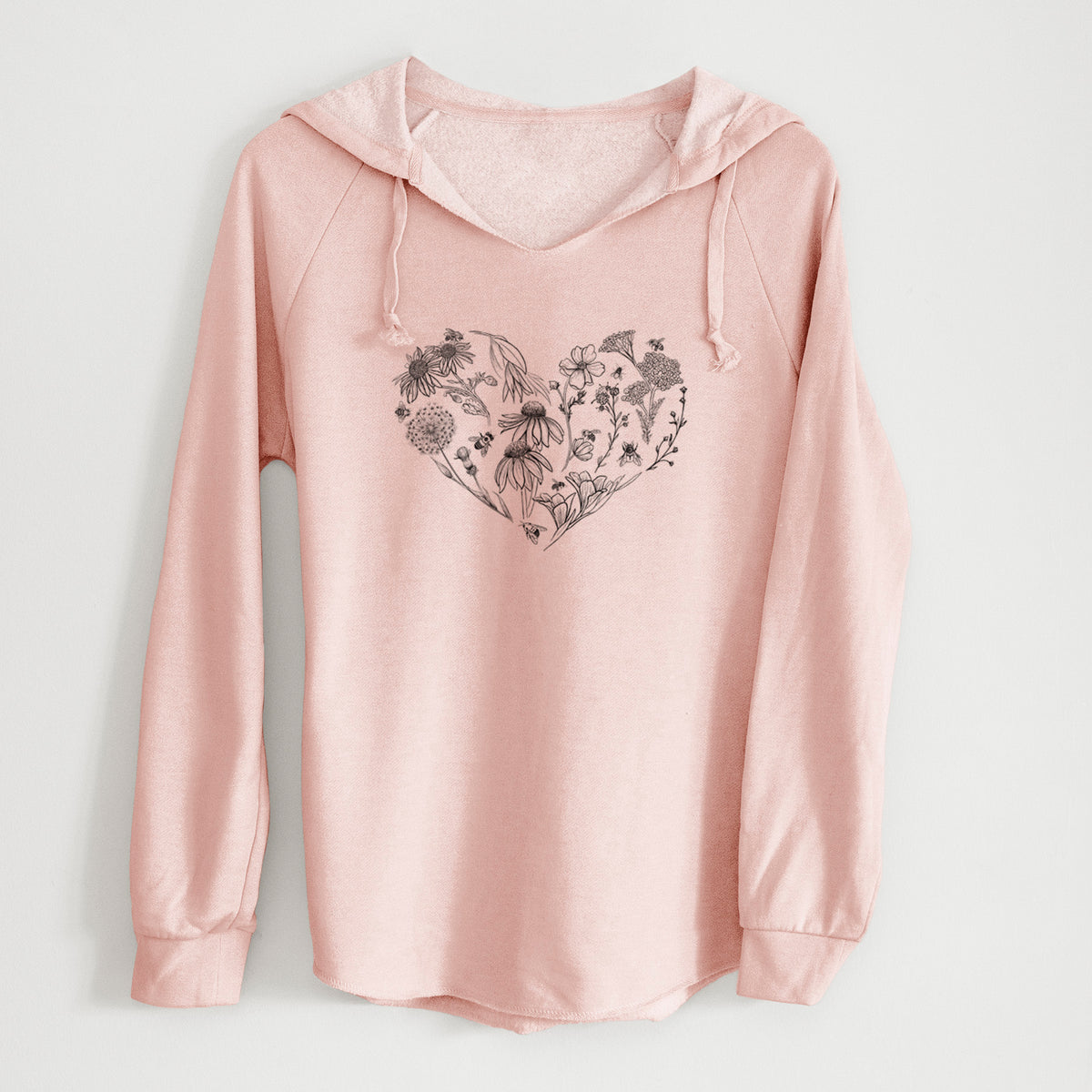 Blush pink women's Cali Wave hooded sweatshirt laid flat, printed with a heart shape filled with black ink flowers and bees.