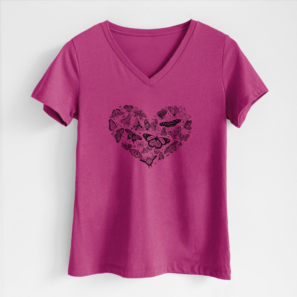 Berry pink women's relaxed fit cotton V-neck t-shirt laid flat, printed with a heart shape filled with small black ink butterflies and moths.