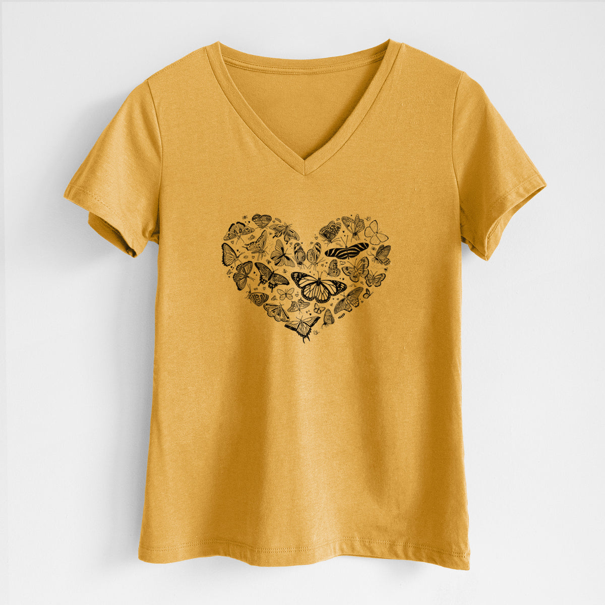 Honeycomb yellow women's relaxed fit cotton V-neck t-shirt laid flat, printed with a heart shape filled with small black ink butterflies and moths.