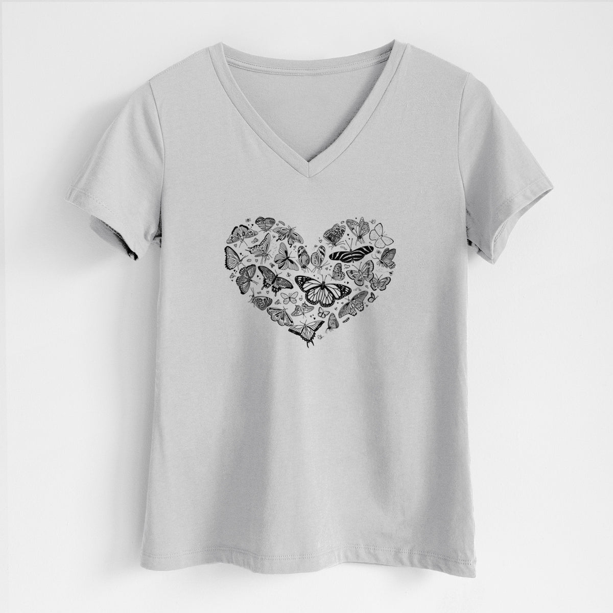 Lunar grey women's relaxed fit cotton V-neck t-shirt laid flat, printed with a heart shape filled with small black ink butterflies and moths.
