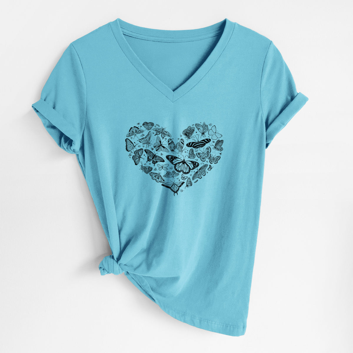 Turquoise women's relaxed fit cotton V-neck t-shirt laid flat, printed with a heart shape filled with small black ink butterflies and moths.
