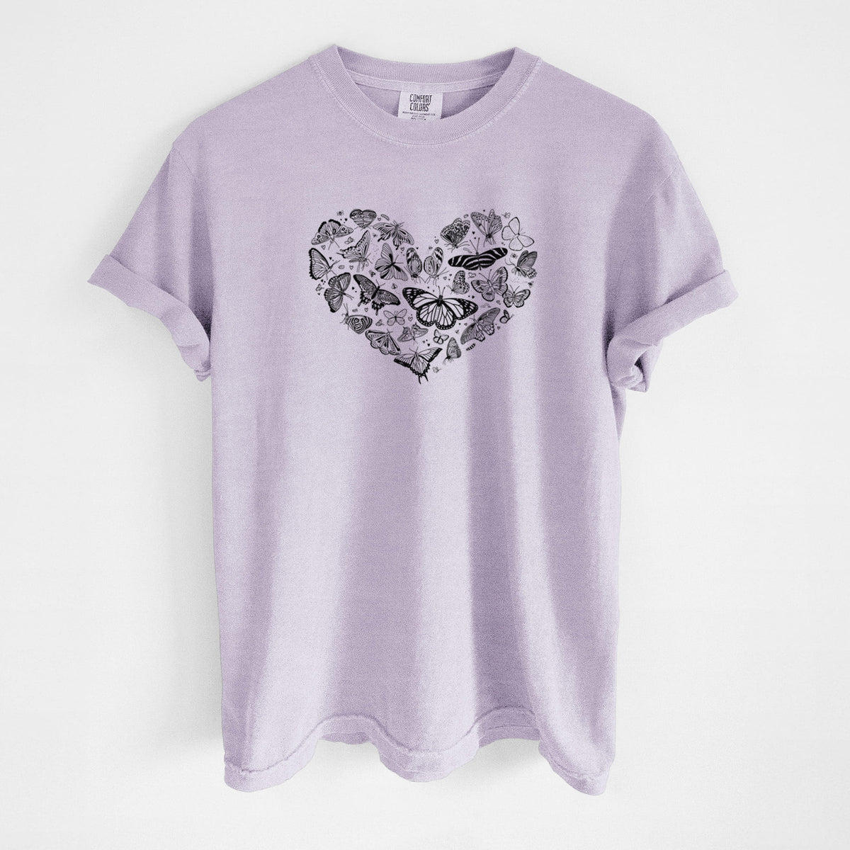 Orchid purple Comfort Colors t-shirt laid flat, printed with a heart shape filled with small black ink butterflies and moths.