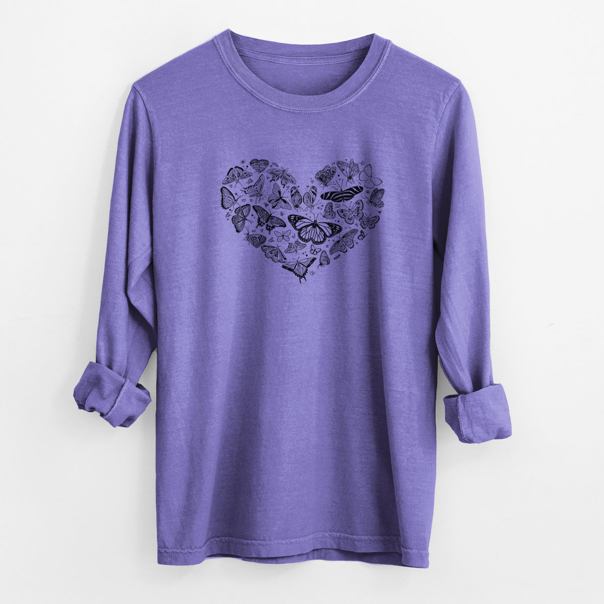 Violet purple Comfort Colors long sleeve shirt laid flat with the cuffs rolled, printed with a heart shape filled with small black ink butterflies and moths.