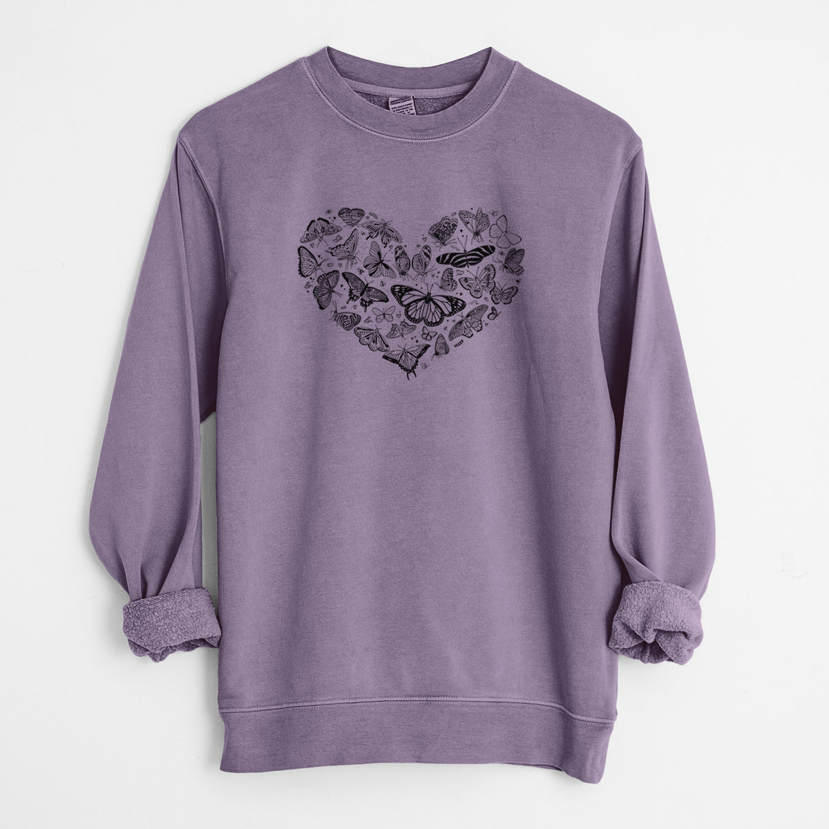 Plum purple pigment dyed crewneck sweatshirt laid flat with the sleeves rolled, printed with a heart shape filled with small black ink butterflies and moths.