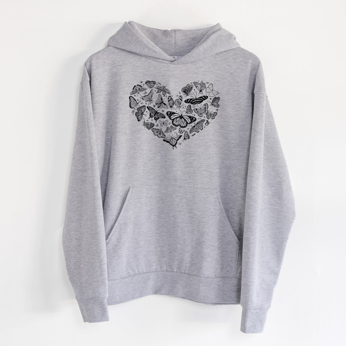 Heart Full of Butterflies - Statement Midweight Hoodie in Heather Grey, hanging on a white wall, with a front kangaroo pocket and no drawcords.
