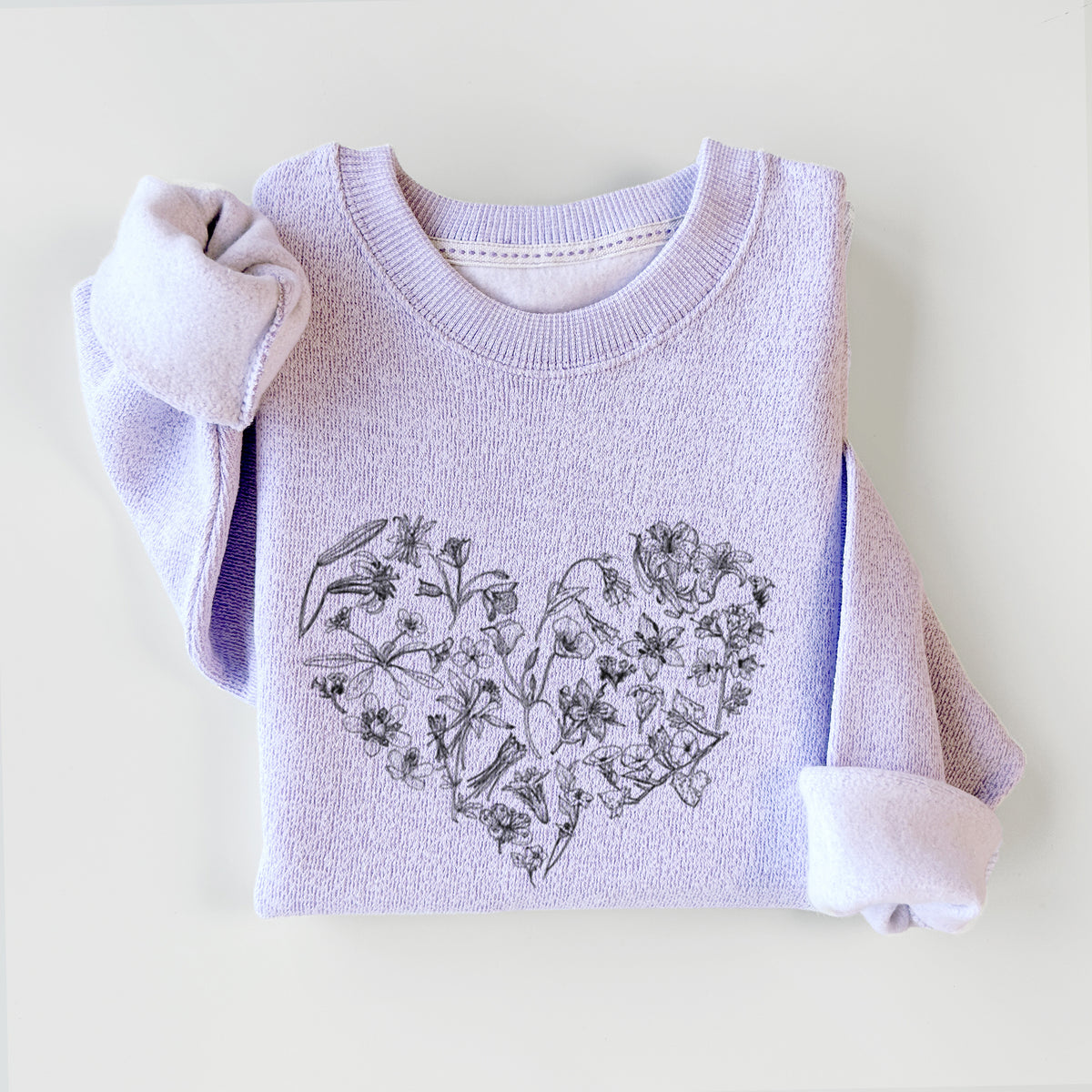 Ice purple knit sweatshirt printed with a heart shape filled with black ink California mountain wildflowers, styled flat.