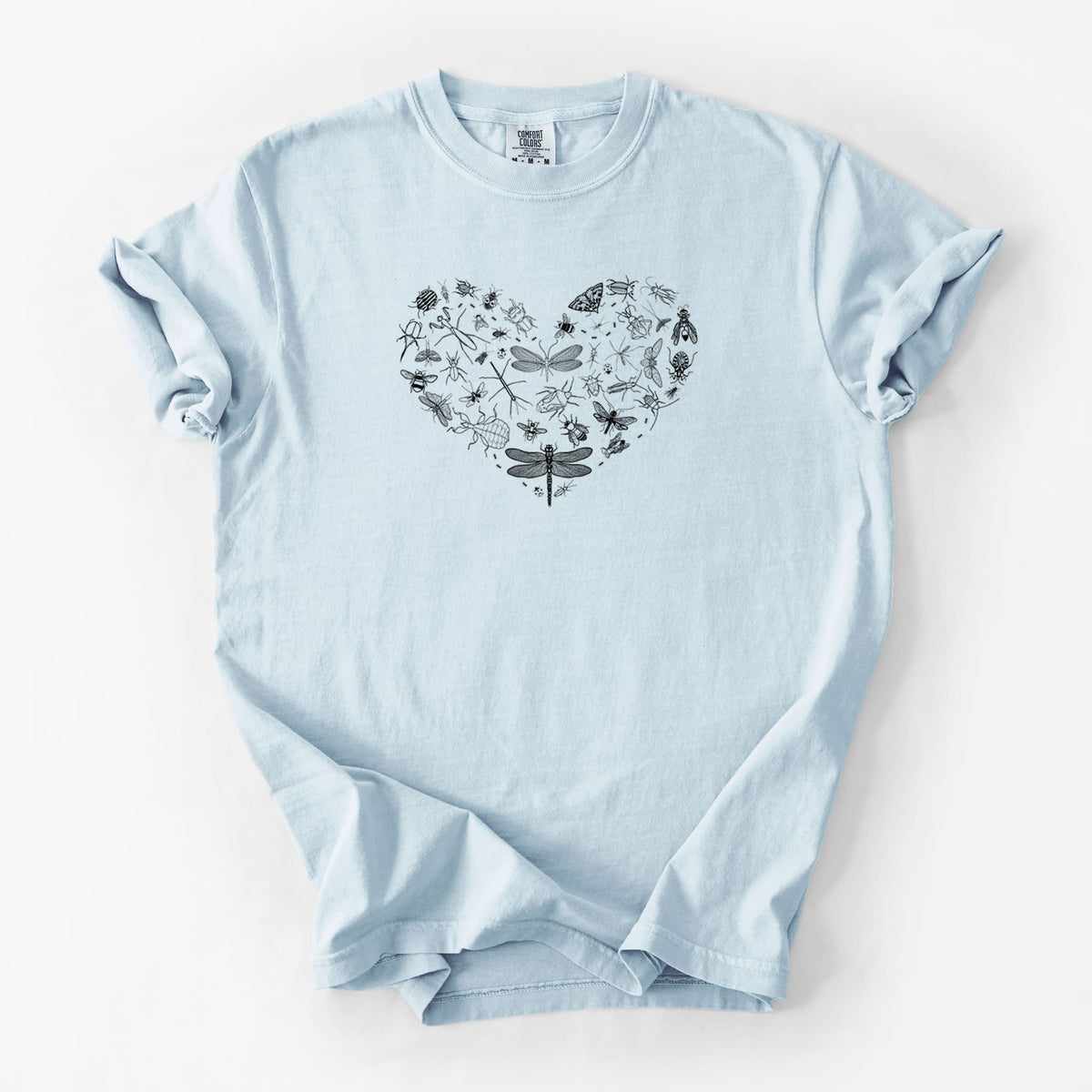 Chambray blue Comfort Colors t-shirt laid flat, printed with a heart shape filled with small black ink insects, including dragonflies, beetles and bees.