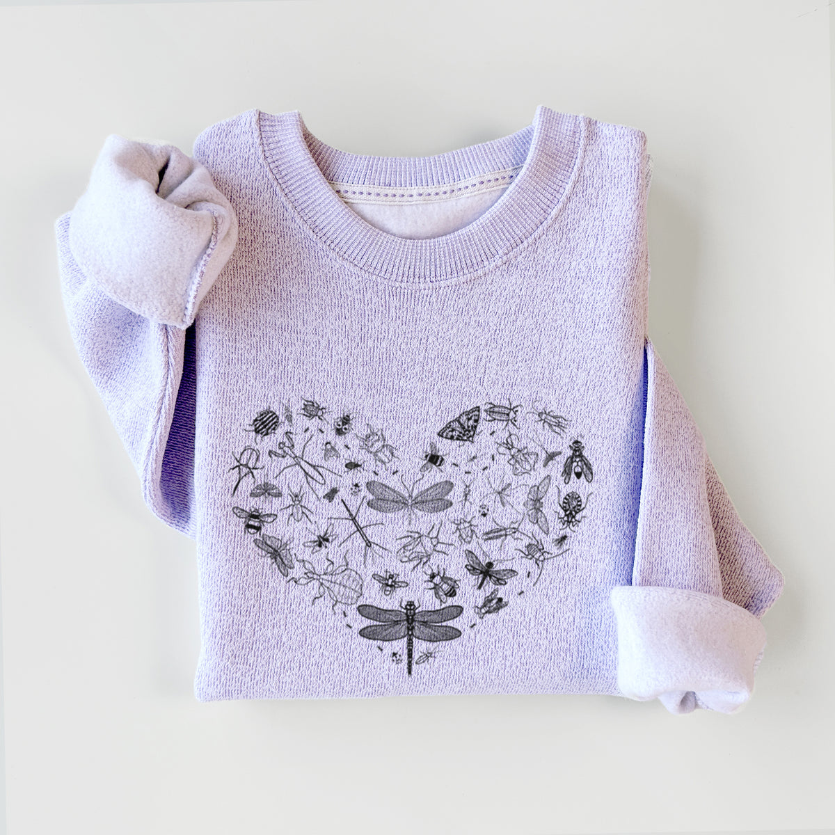 Ice purple knit sweatshirt printed with a heart shape filled with small black ink insects, including dragonflies, beetles and bees, styled flat.