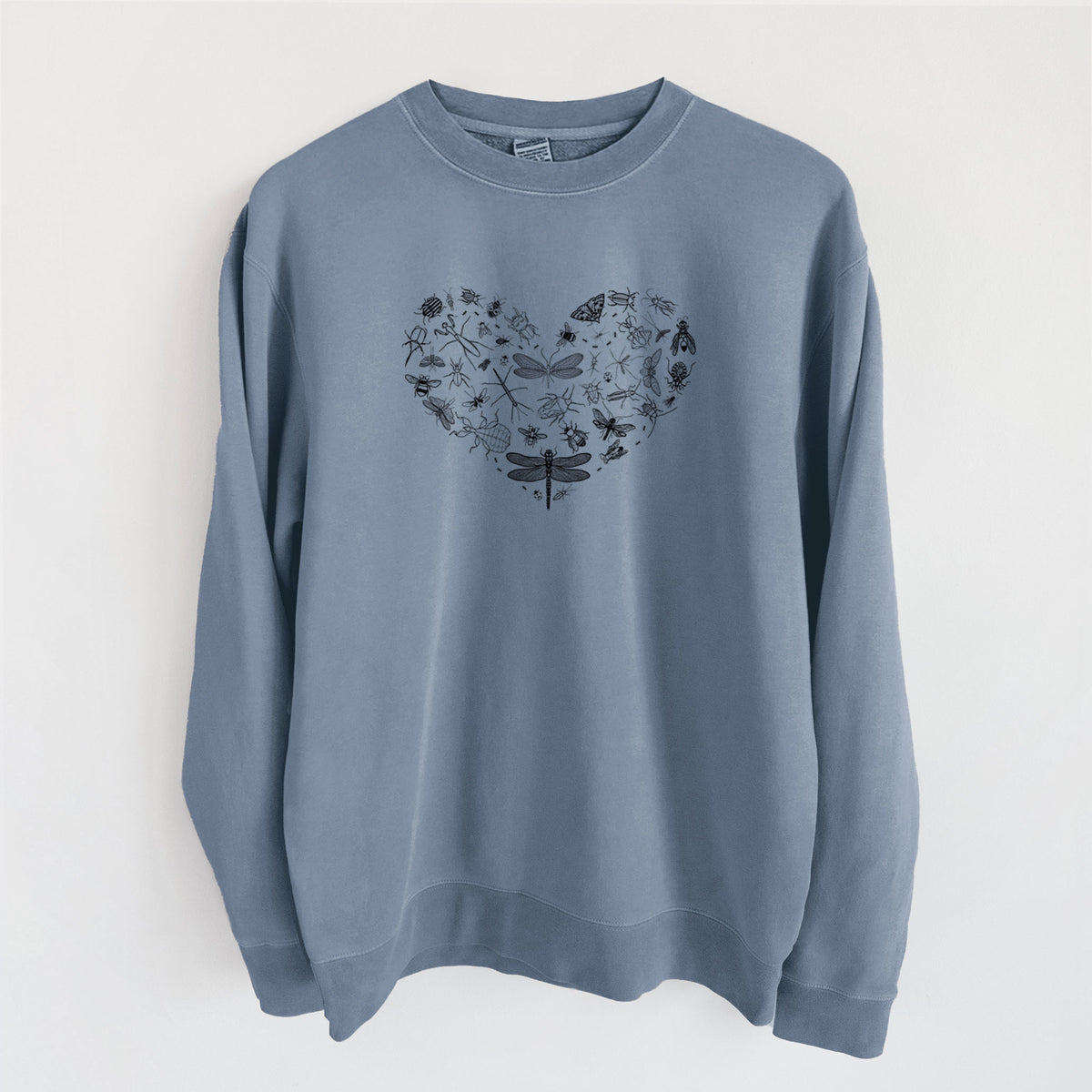 Slate blue pigment dyed crewneck sweatshirt laid flat, printed with a heart shape filled with small black ink insects, including dragonflies, beetles and bees.