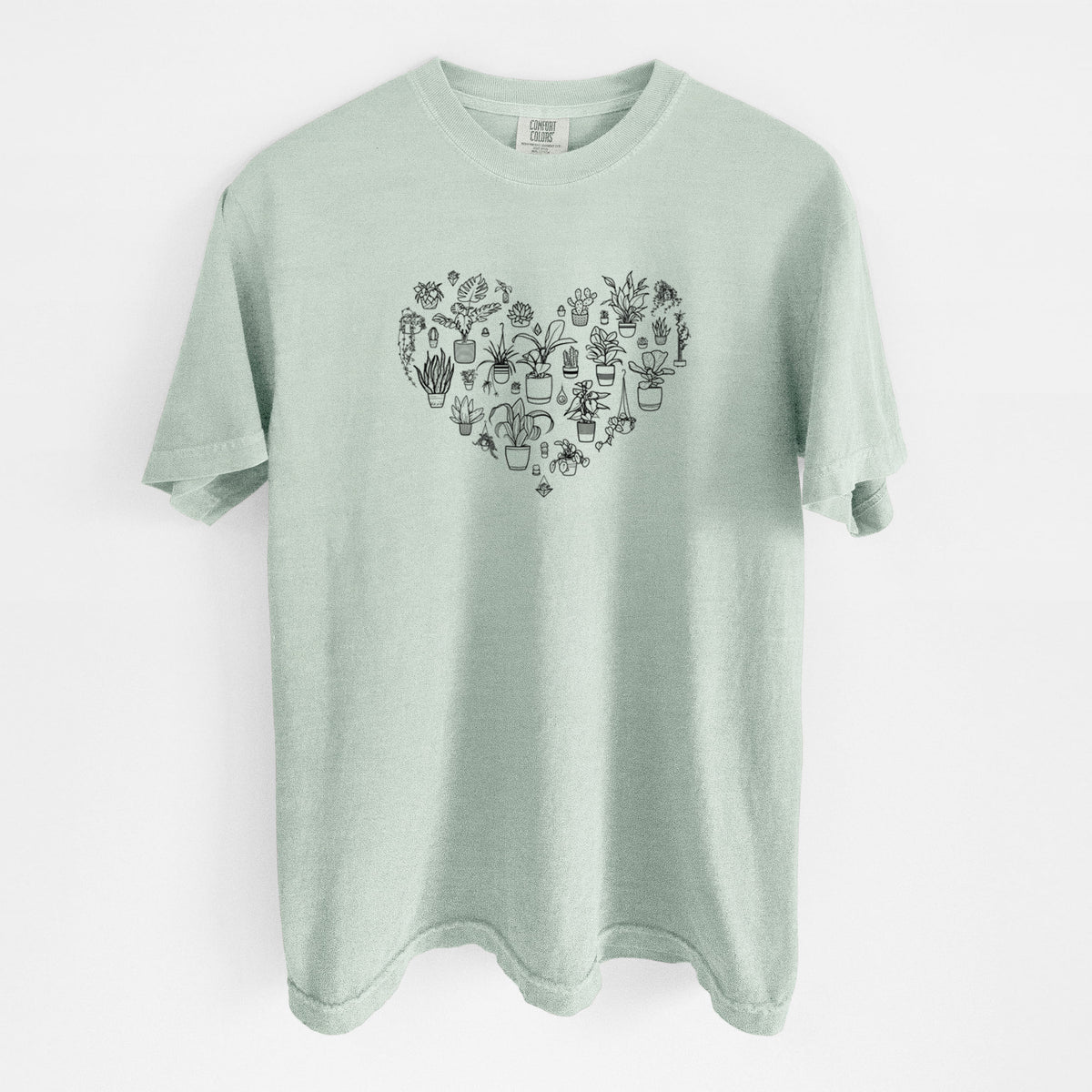 Bay green Comfort Colors t-shirt laid flat, printed with a heart shape filled with black ink potted houseplants.