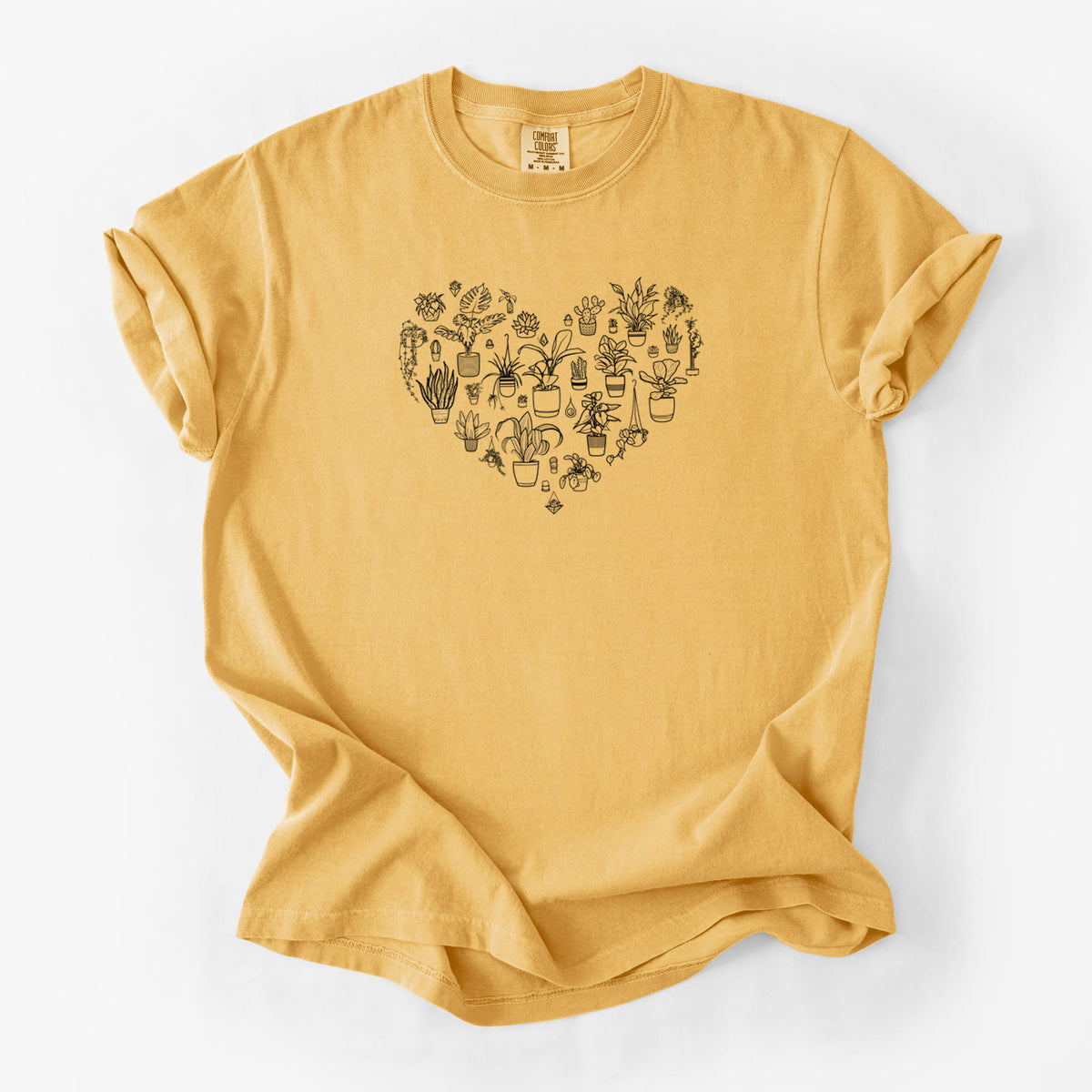 Golden wheat yellow Comfort Colors t-shirt laid flat, printed with a heart shape filled with black ink potted houseplants.