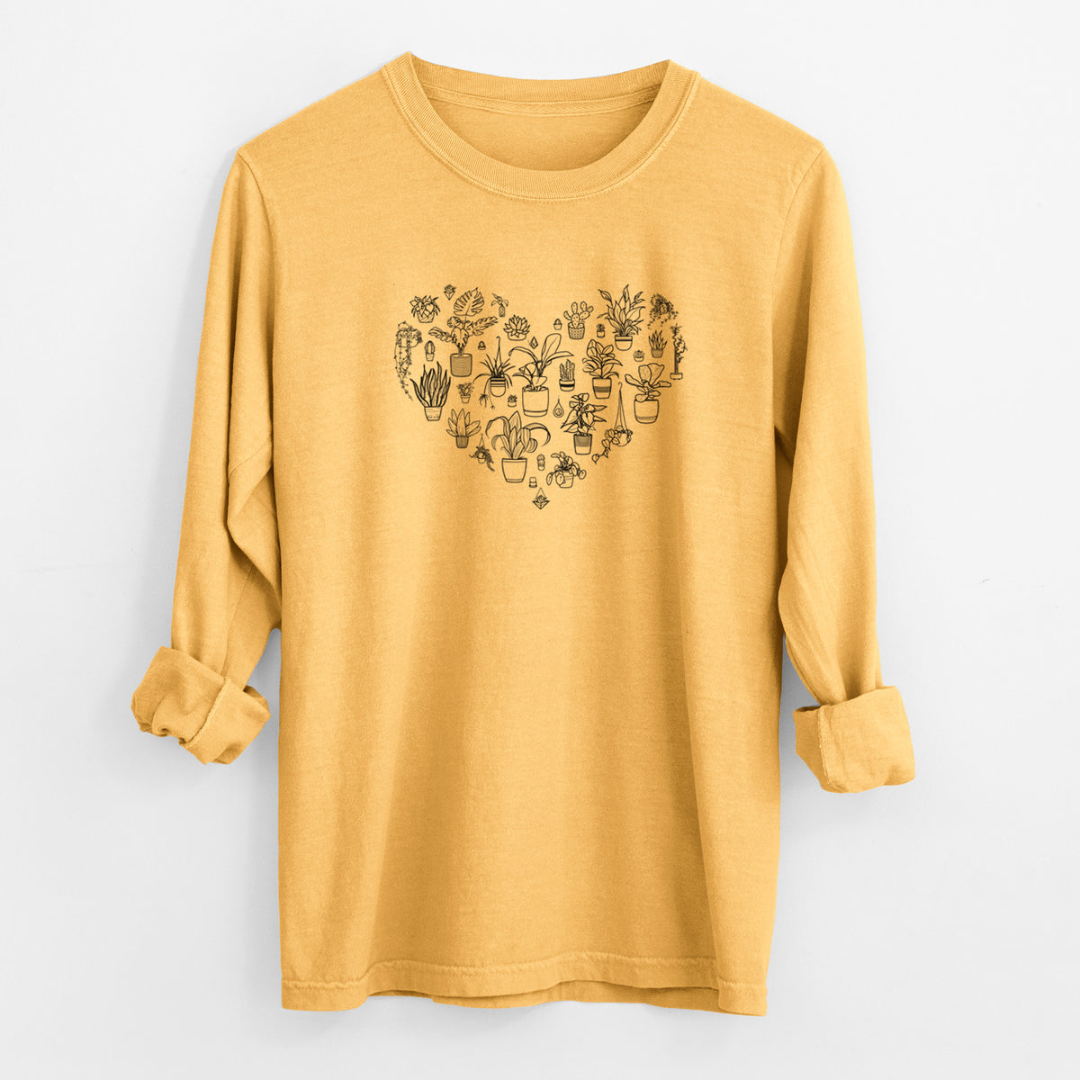 Golden wheat yellow Comfort Colors long sleeve shirt laid flat with the cuffs rolled, printed with a heart shape filled with black ink potted houseplants.