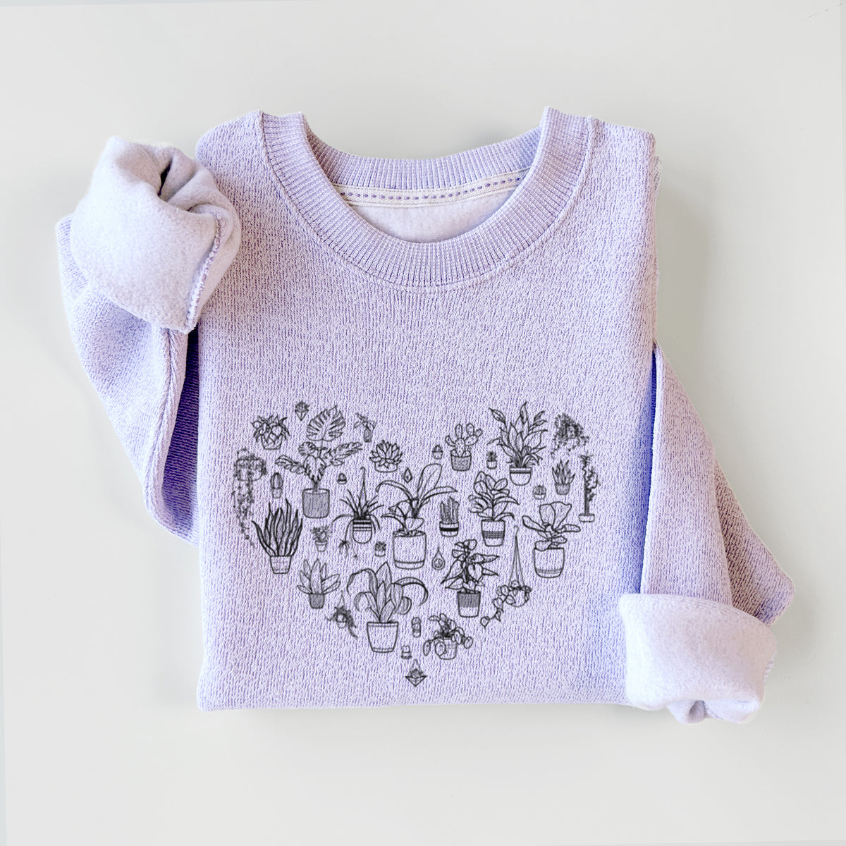 Ice purple knit sweatshirt printed with a heart shape filled with black ink potted houseplants, styled flat.