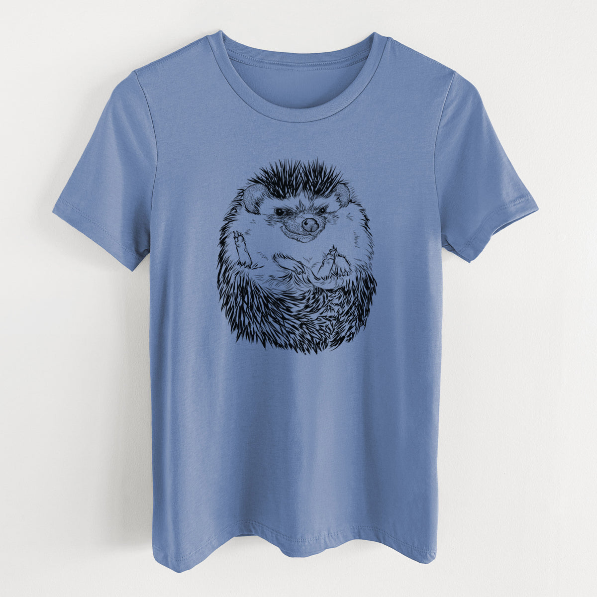 Blue bell women's relaxed fit cotton t-shirt laid flat, printed with a detailed black ink illustration of a hedgehog curled up and facing forward.