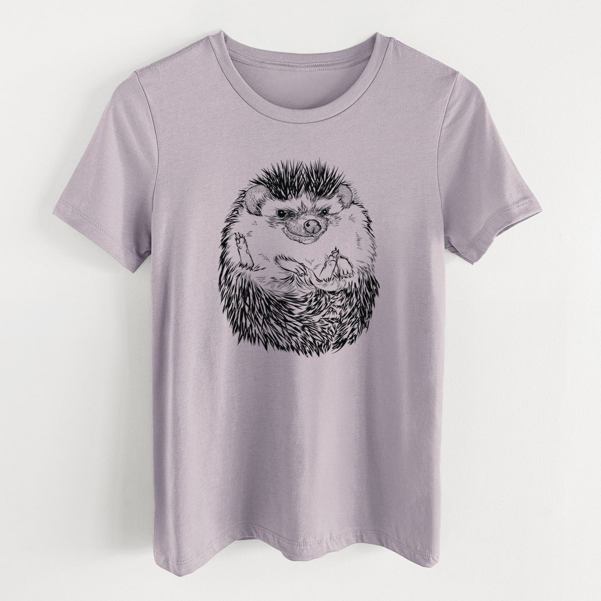 Light violet women's relaxed fit cotton t-shirt laid flat, printed with a detailed black ink illustration of a hedgehog curled up and facing forward.