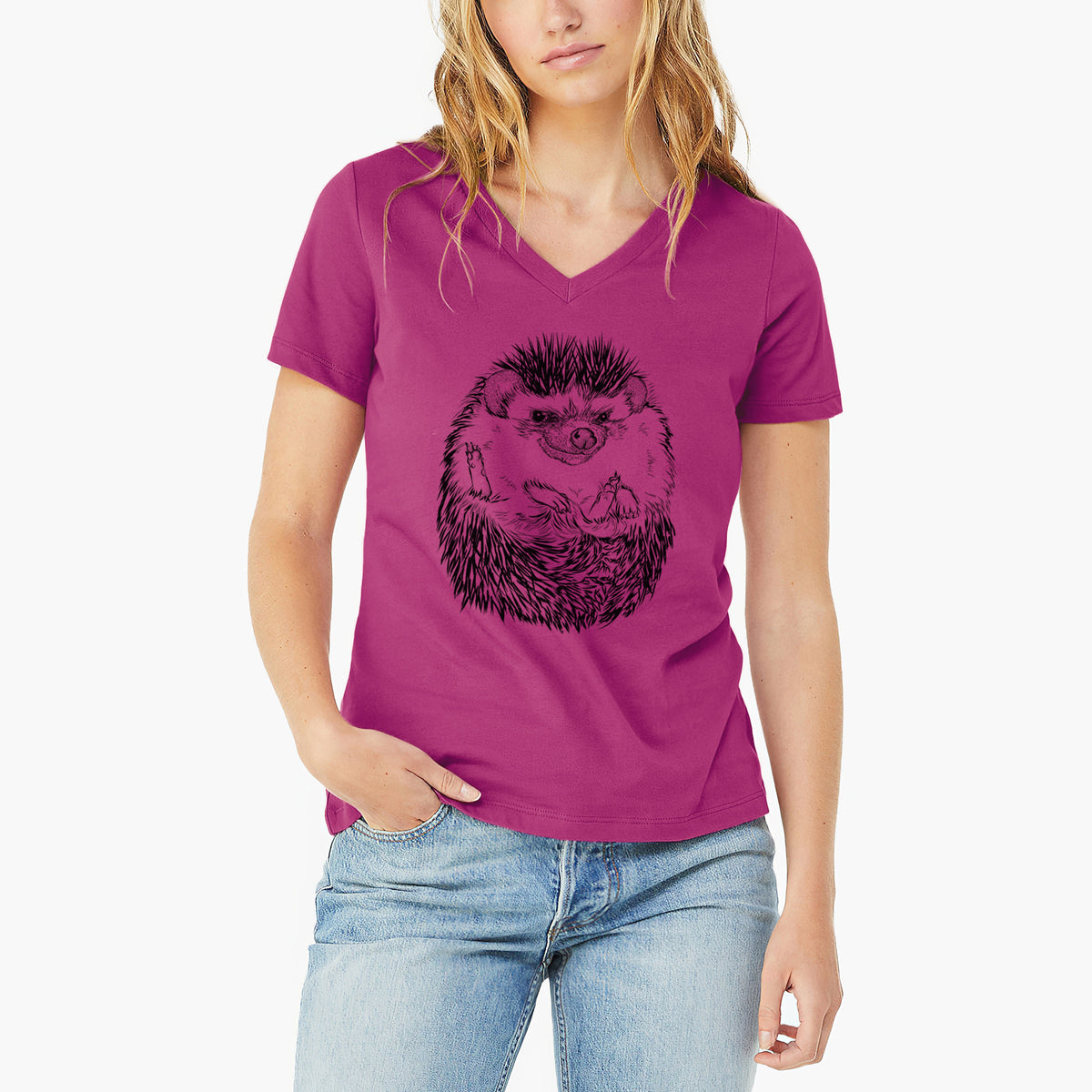 Woman wearing a berry pink women's relaxed fit cotton V-neck t-shirt printed with a detailed black ink illustration of a hedgehog curled up and facing forward.