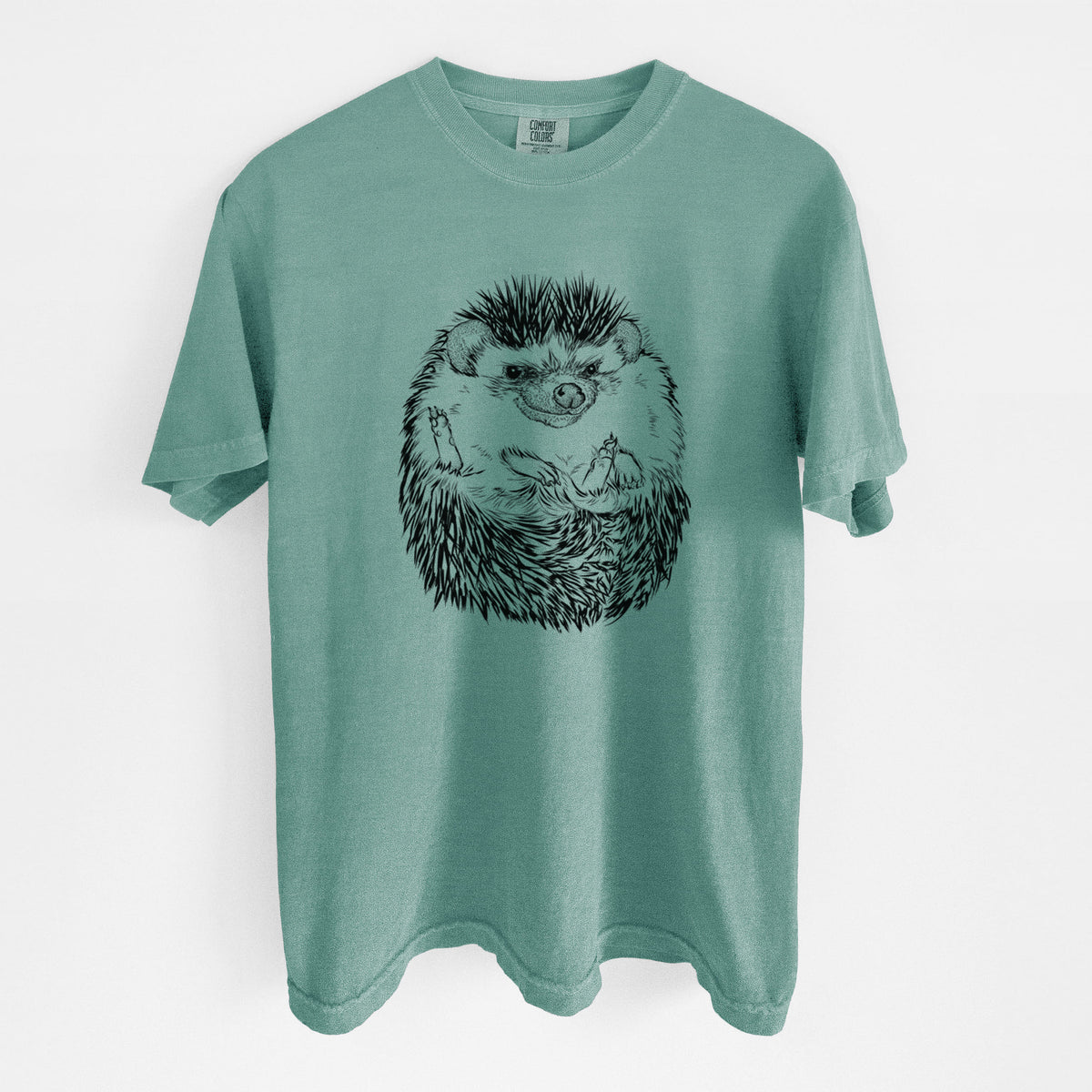 Reef green Comfort Colors t-shirt laid flat, printed with a detailed black ink illustration of a hedgehog curled up and facing forward.