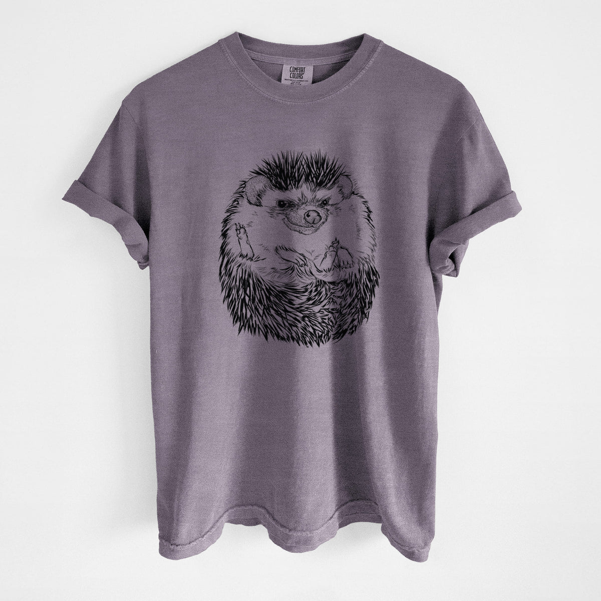 Wine red Comfort Colors t-shirt laid flat, printed with a detailed black ink illustration of a hedgehog curled up and facing forward.