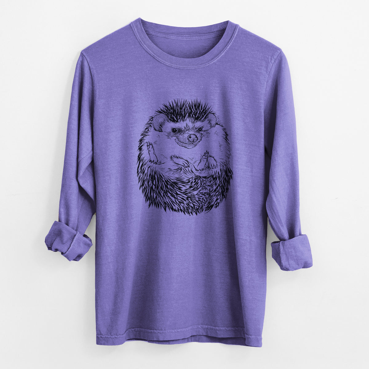 Violet purple Comfort Colors long sleeve shirt laid flat with the cuffs rolled, printed with a detailed black ink illustration of a hedgehog curled up and facing forward.