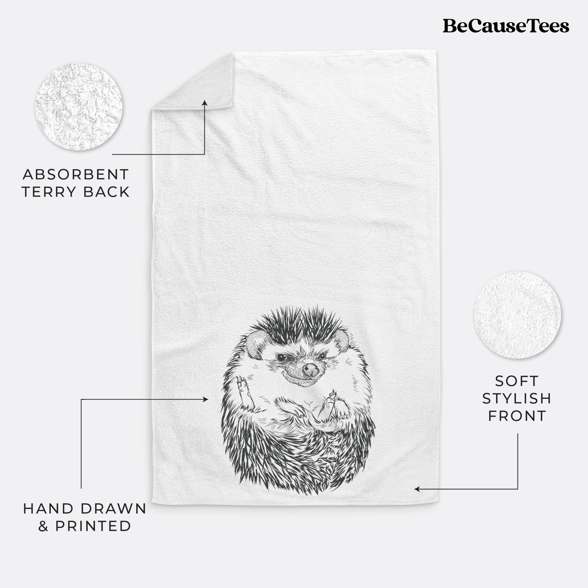 White hand towel printed with a detailed black ink illustration of a hedgehog curled up and facing forward.