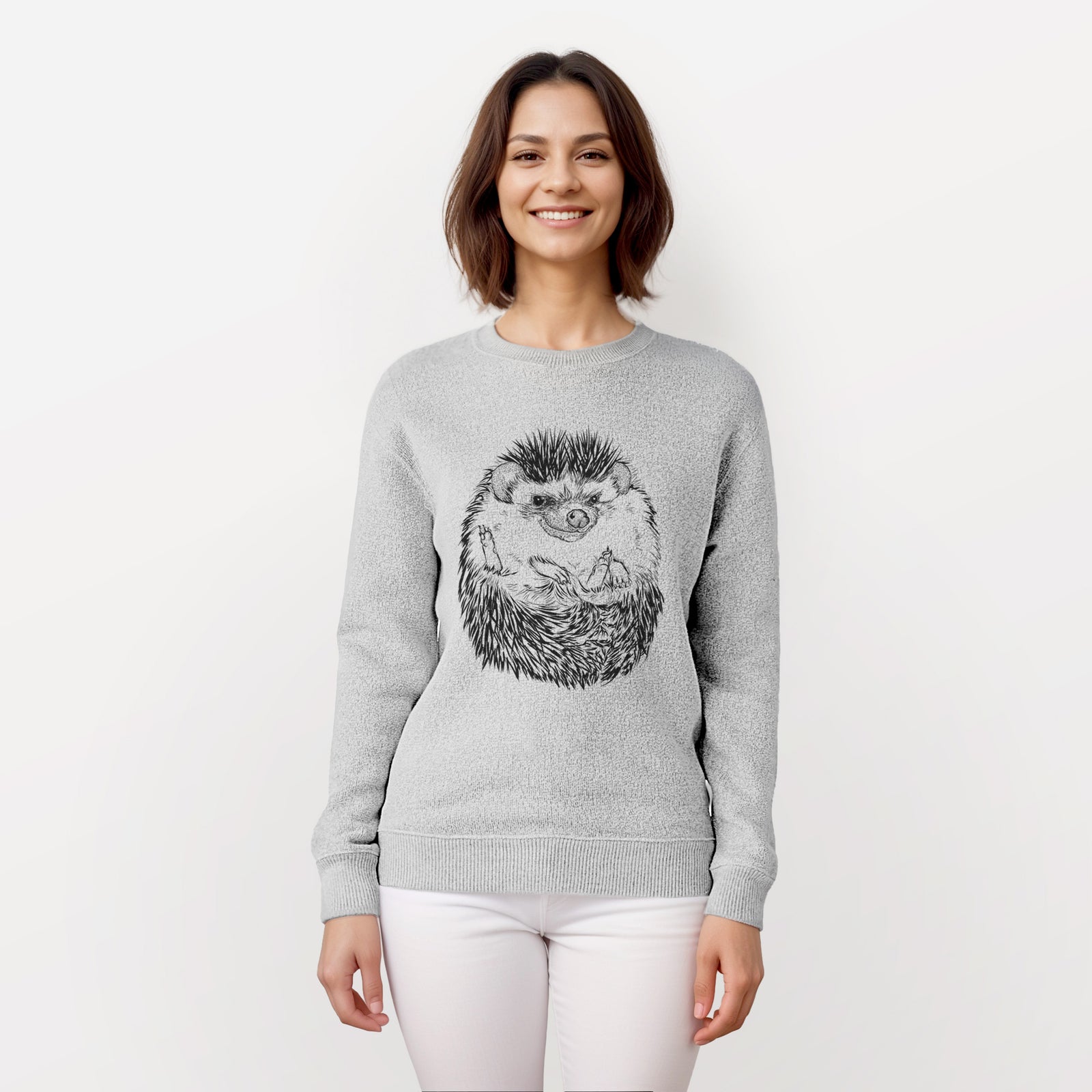Salt and pepper knit sweatshirt laid flat, printed with a detailed black ink illustration of a hedgehog curled up and facing forward.