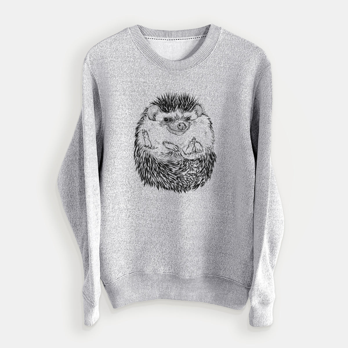 Salt and pepper knit sweatshirt laid flat, printed with a detailed black ink illustration of a hedgehog curled up and facing forward.