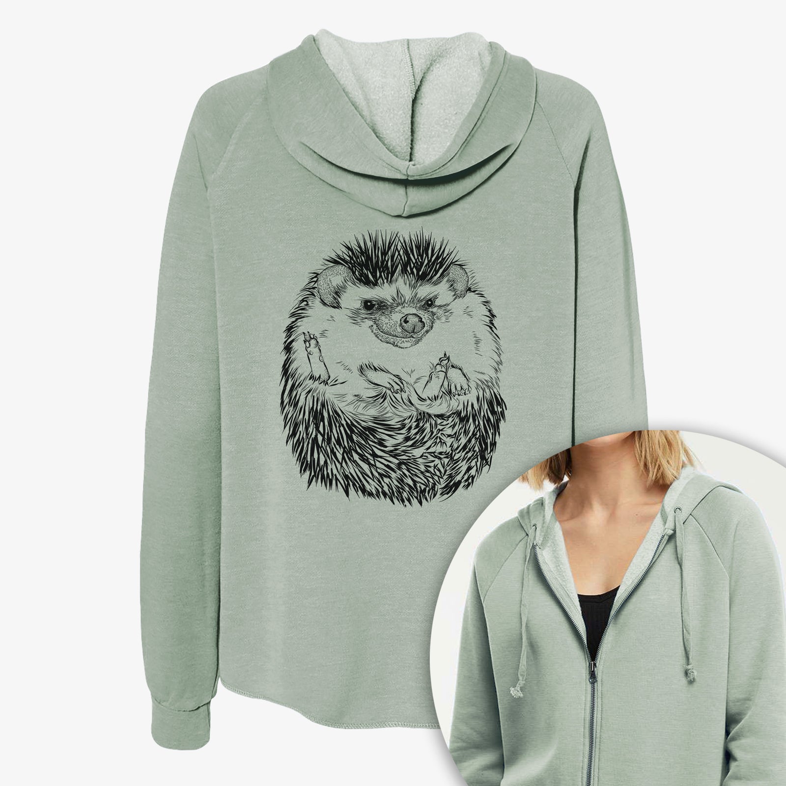 Women's Cali Wave zip-up sweatshirt printed with a detailed black ink illustration of a hedgehog curled up and facing forward, with a close-up of the zipper.
