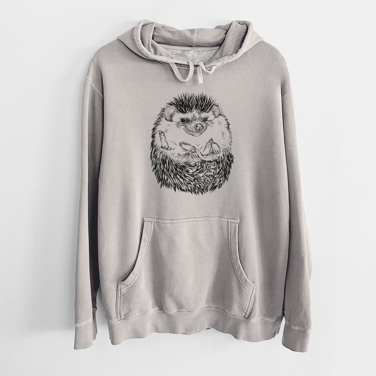 Cement grey pigment dyed hoodie laid flat, printed with a detailed black ink illustration of a hedgehog curled up and facing forward.