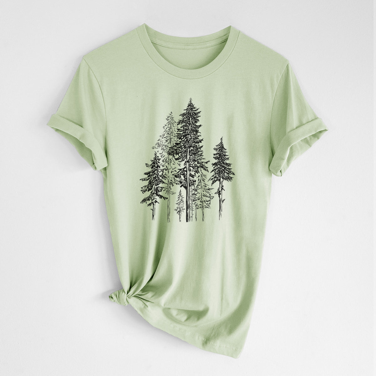 Spring green lightweight cotton t-shirt laid flat with the sleeves rolled, printed with a black ink illustration of a forest of tall hemlock trees.