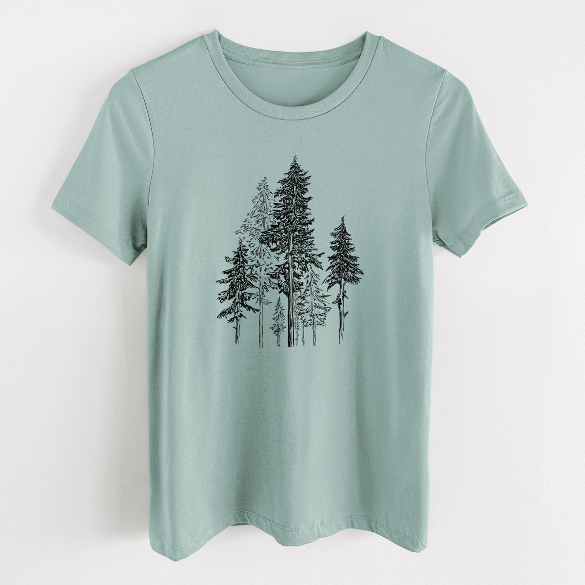 Dusty blue women's relaxed fit cotton t-shirt laid flat, printed with a black ink illustration of a forest of tall hemlock trees.