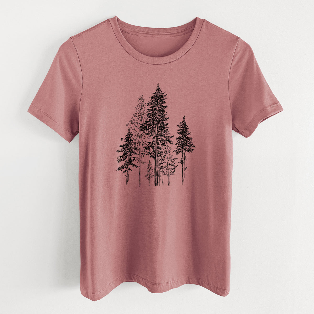 Mauve pink women's relaxed fit cotton t-shirt laid flat, printed with a black ink illustration of a forest of tall hemlock trees.