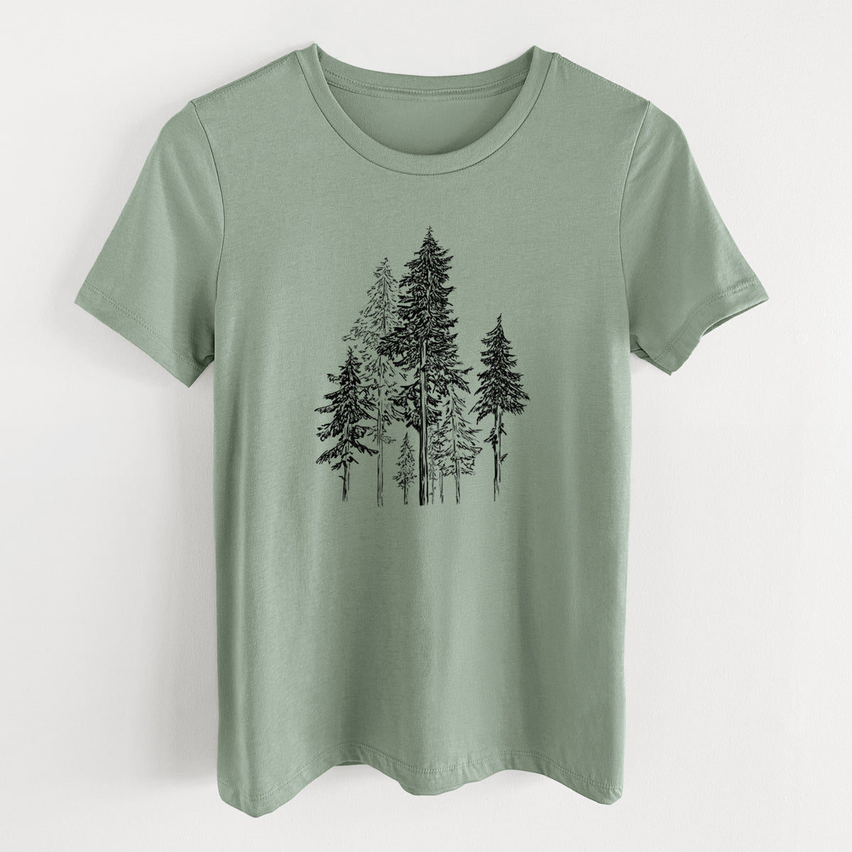 Sage green women's relaxed fit cotton t-shirt laid flat, printed with a black ink illustration of a forest of tall hemlock trees.