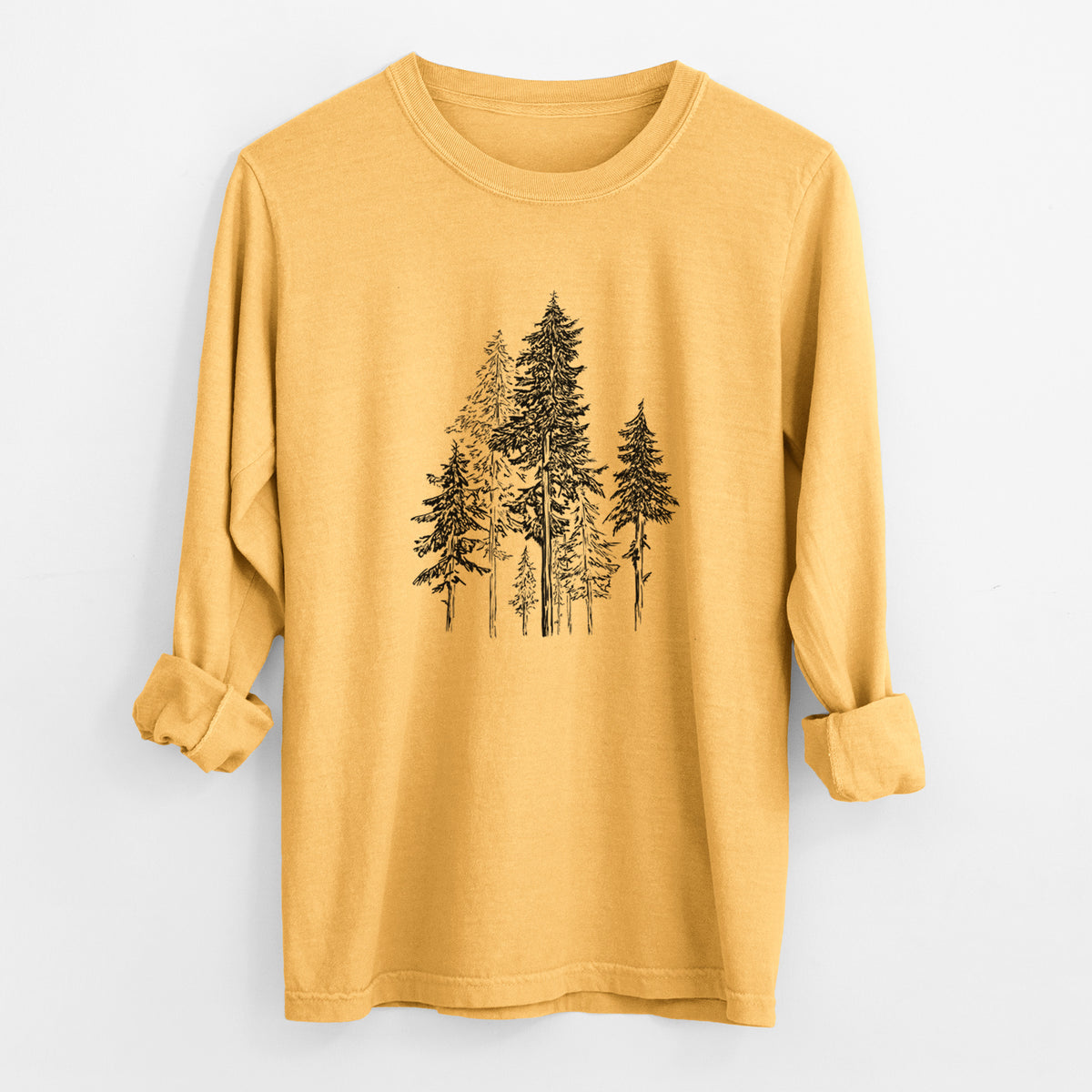 Golden wheat yellow Comfort Colors long sleeve shirt laid flat with the cuffs rolled, printed with a black ink illustration of a forest of tall hemlock trees.