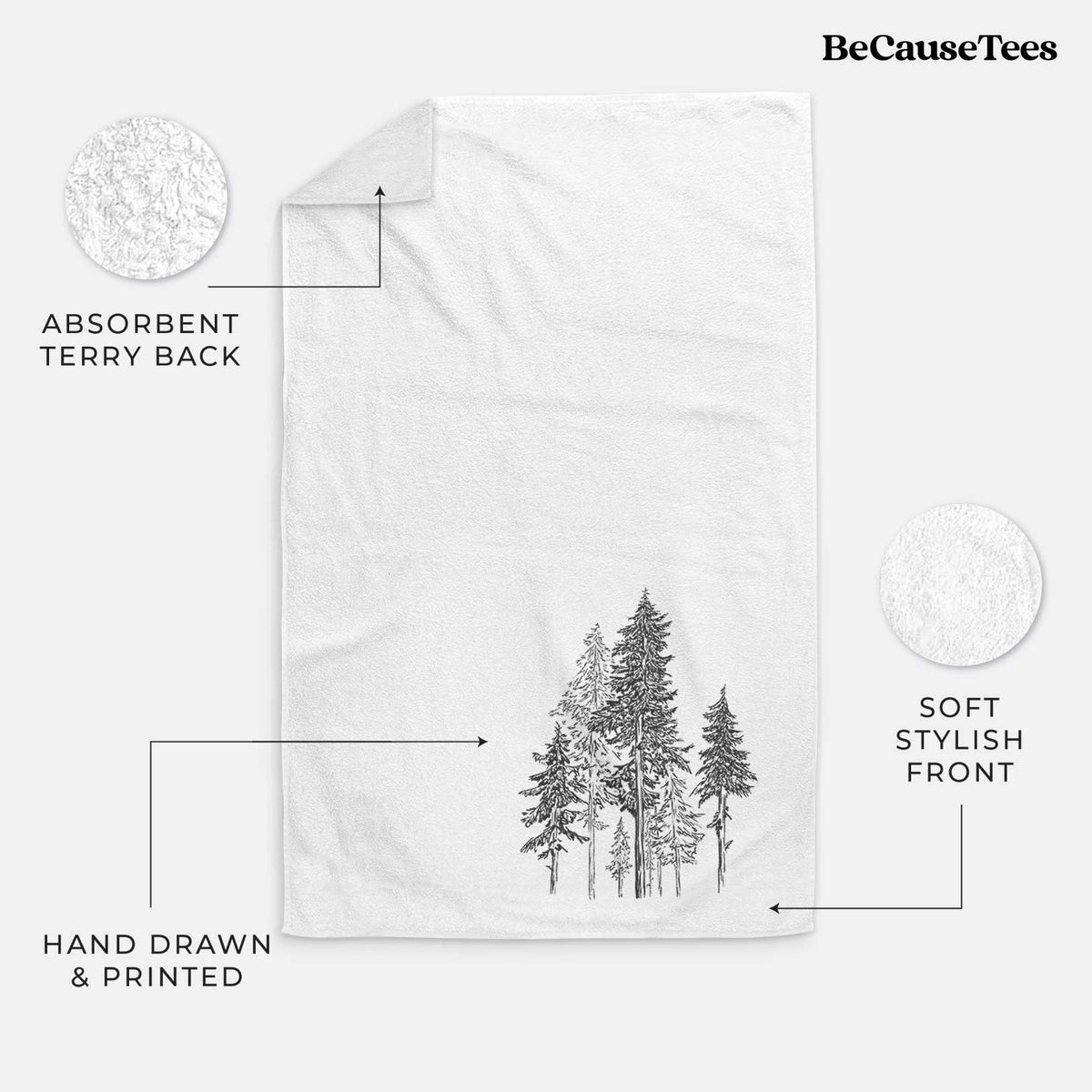 White hand towel printed with a black ink illustration of a forest of tall hemlock trees.