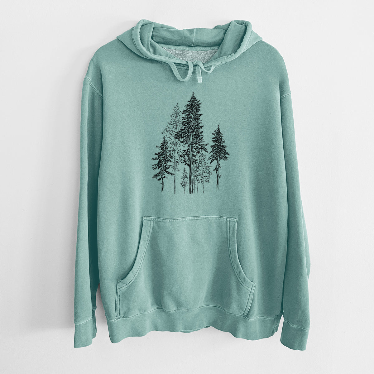 Mint green pigment dyed hoodie laid flat, printed with a black ink illustration of a forest of tall hemlock trees.