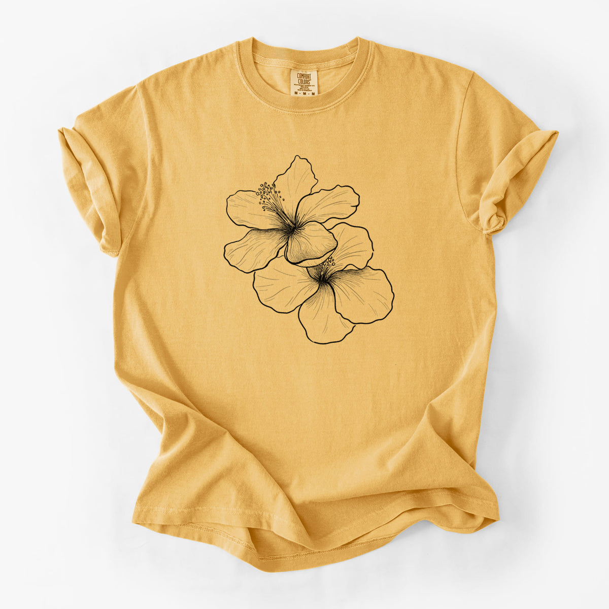 Golden wheat yellow Comfort Colors t-shirt laid flat, printed with a black ink line drawing of three hibiscus flowers.