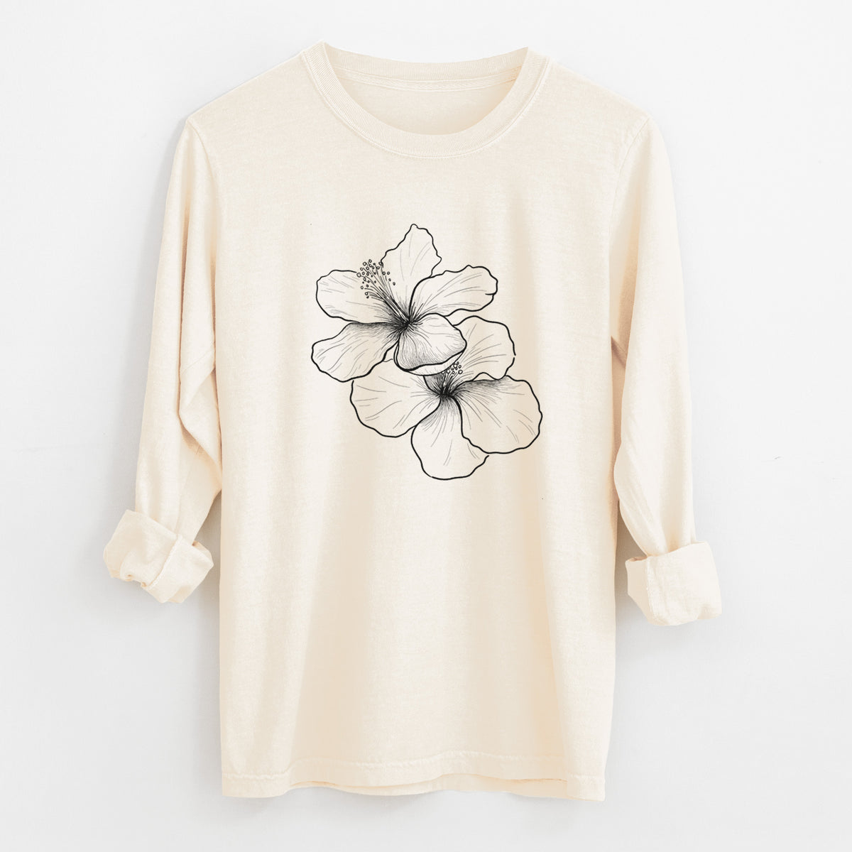 Ivory Comfort Colors long sleeve shirt laid flat with the cuffs rolled, printed with a black ink line drawing of three hibiscus flowers.