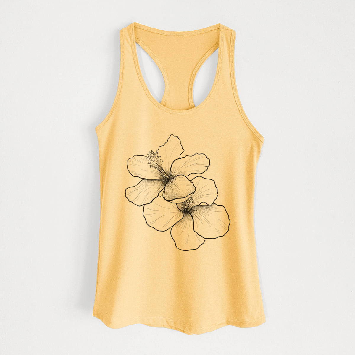 Banana cream women's racerback tank top laid flat, printed with a black ink line drawing of three hibiscus flowers.