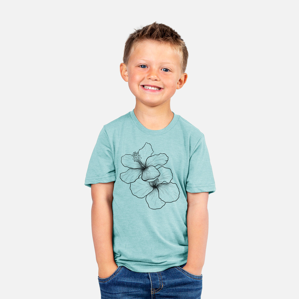 Smiling boy wearing a youth t-shirt printed with a black ink line drawing of three hibiscus flowers.