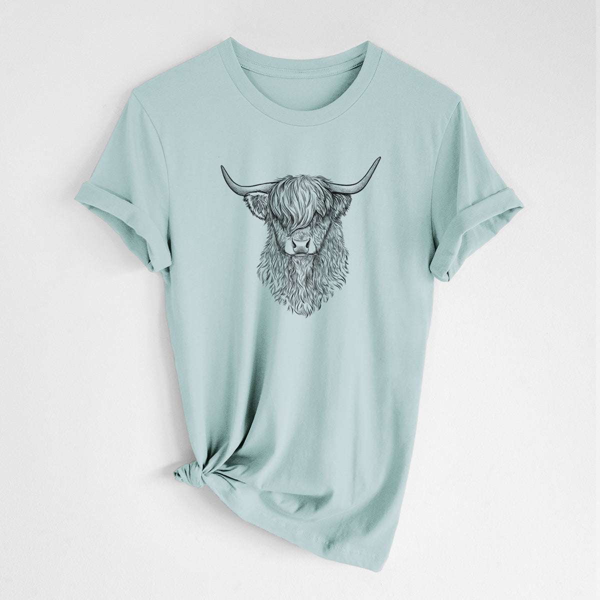 Dusty blue lightweight cotton t-shirt laid flat with the sleeves rolled, printed with a detailed black ink portrait of a shaggy highland cow with long curved horns.