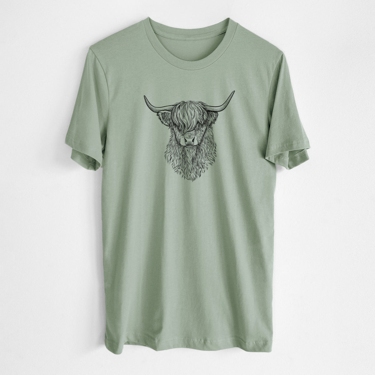 Sage green lightweight cotton t-shirt laid flat, printed with a detailed black ink portrait of a shaggy highland cow with long curved horns.