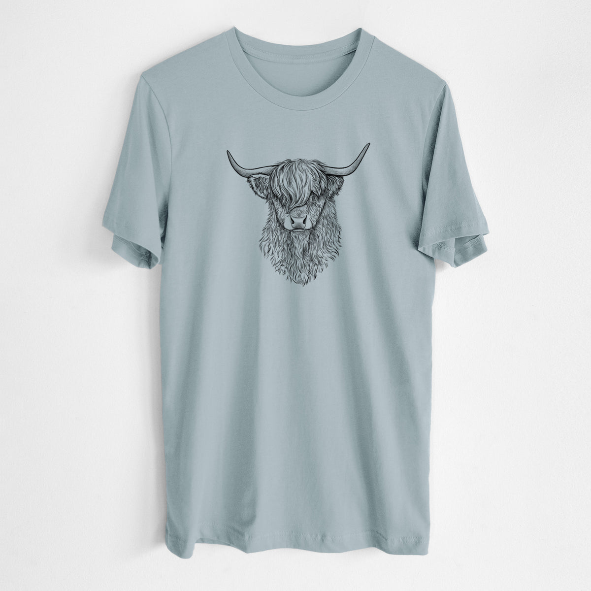 Vintage denim lightweight cotton t-shirt laid flat, printed with a detailed black ink portrait of a shaggy highland cow with long curved horns.