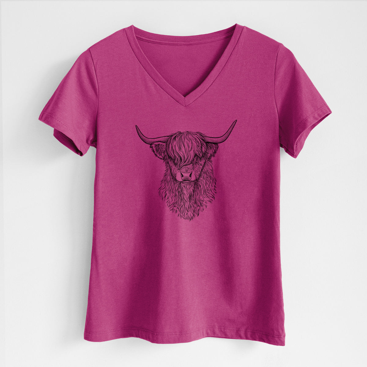 Berry pink women's relaxed fit cotton V-neck t-shirt laid flat, printed with a detailed black ink portrait of a shaggy highland cow with long curved horns.