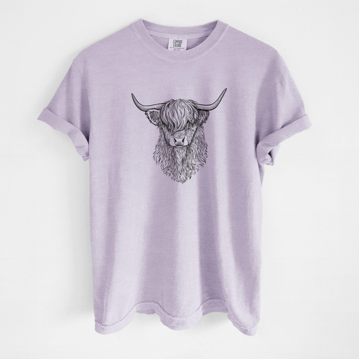 Orchid purple Comfort Colors t-shirt laid flat, printed with a detailed black ink portrait of a shaggy highland cow with long curved horns.