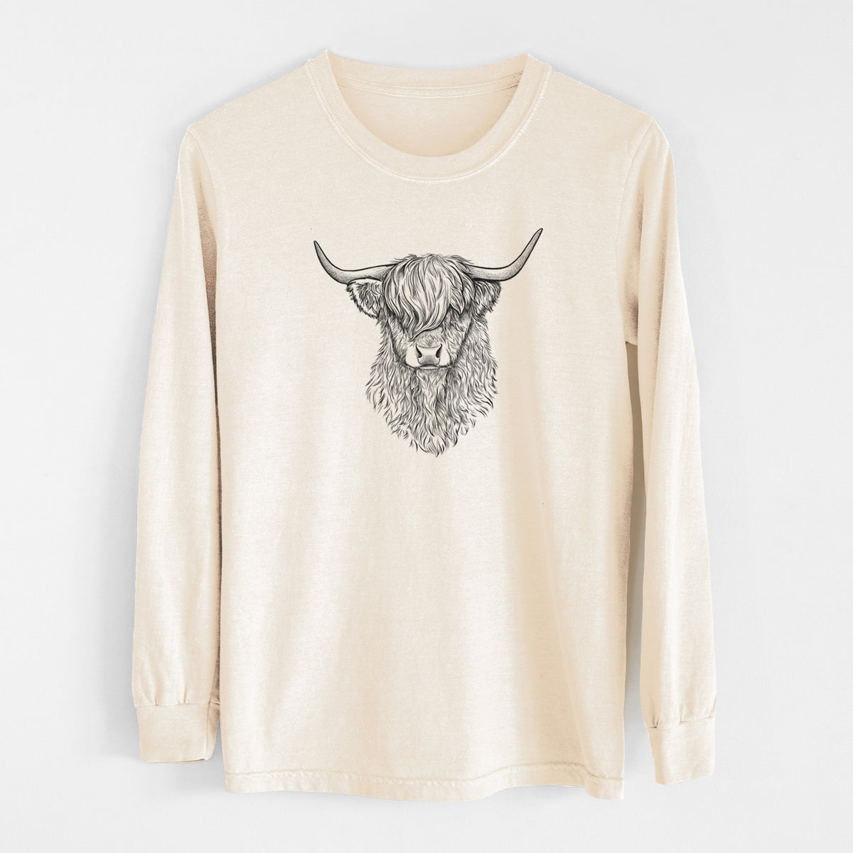 Ivory Comfort Colors long sleeve shirt laid flat, printed with a detailed black ink portrait of a shaggy highland cow with long curved horns.